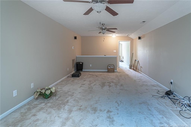 unfurnished living room featuring carpet and ceiling fan