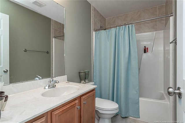 full bathroom with vanity, shower / tub combo, toilet, and visible vents