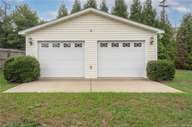 garage featuring a lawn