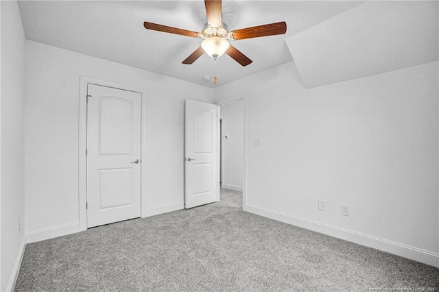 unfurnished bedroom featuring light carpet and ceiling fan