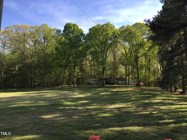 view of home's community with a lawn