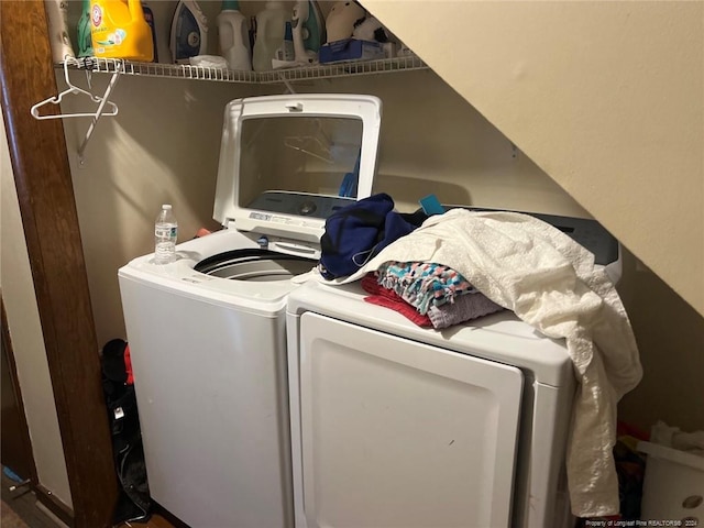 washroom with laundry area and washer and dryer