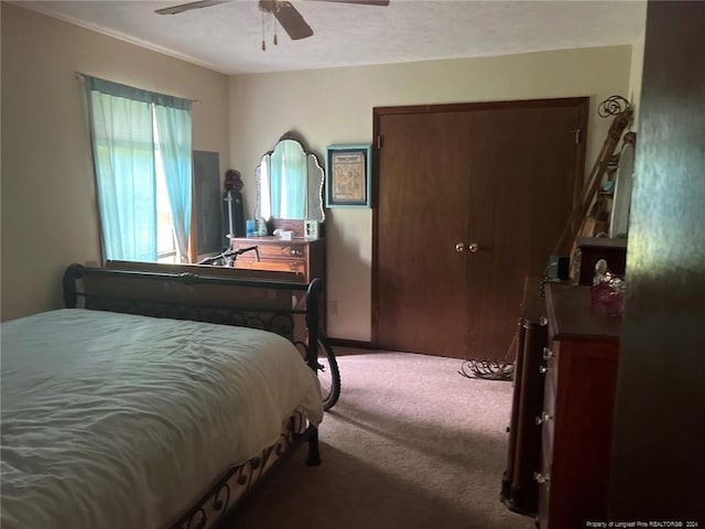 carpeted bedroom with ceiling fan