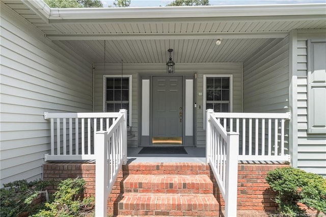 doorway to property with covered porch