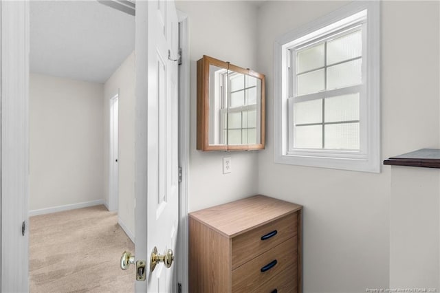 interior space featuring baseboards and a healthy amount of sunlight