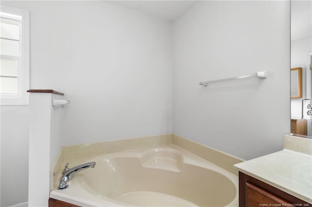 bathroom featuring a bath and vanity