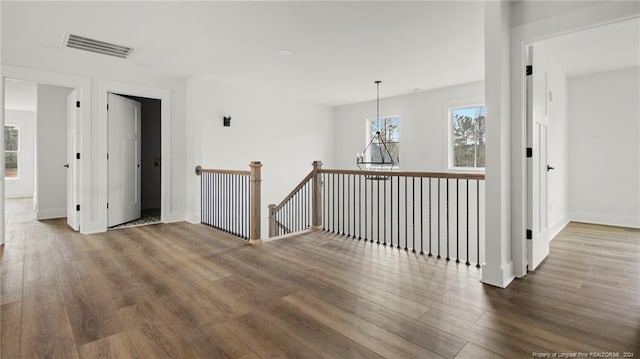 unfurnished room featuring dark wood-type flooring