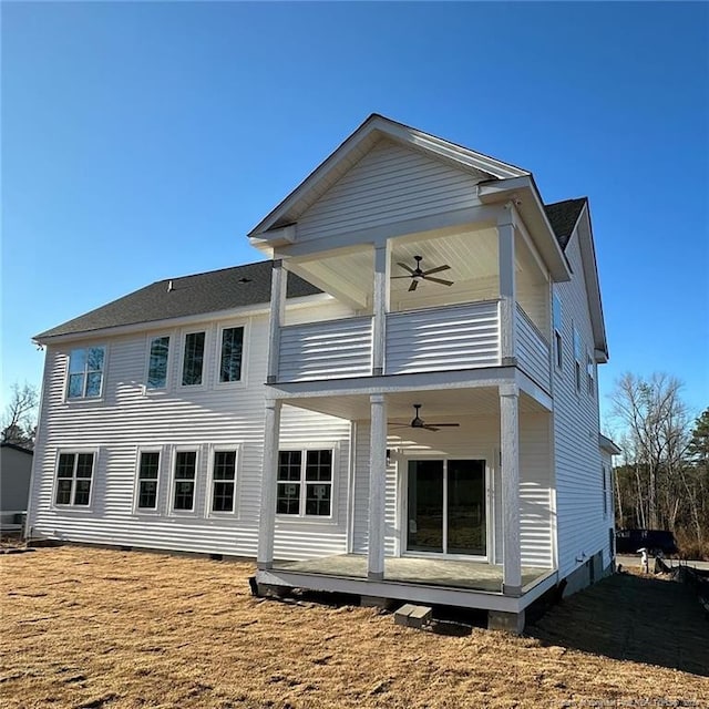 back of property featuring ceiling fan and a balcony