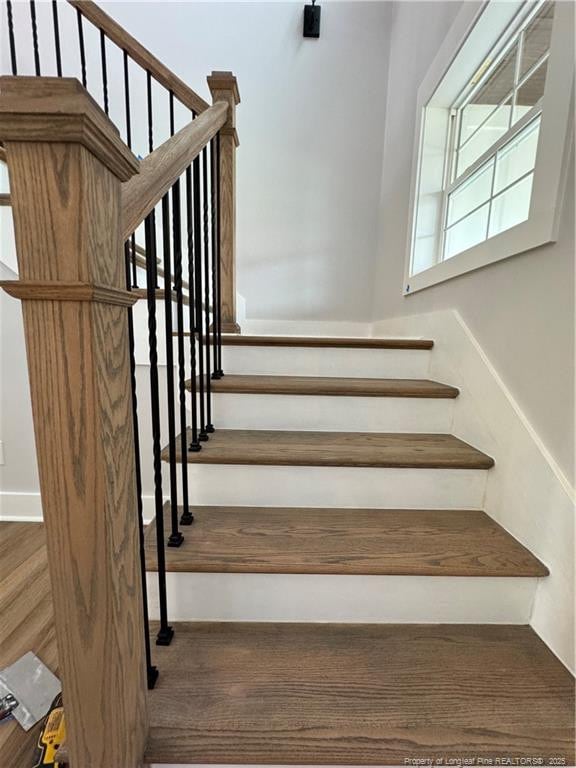 stairs with wood finished floors