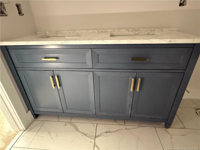 bathroom with marble finish floor