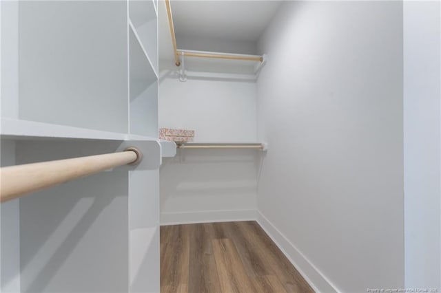 spacious closet with wood finished floors