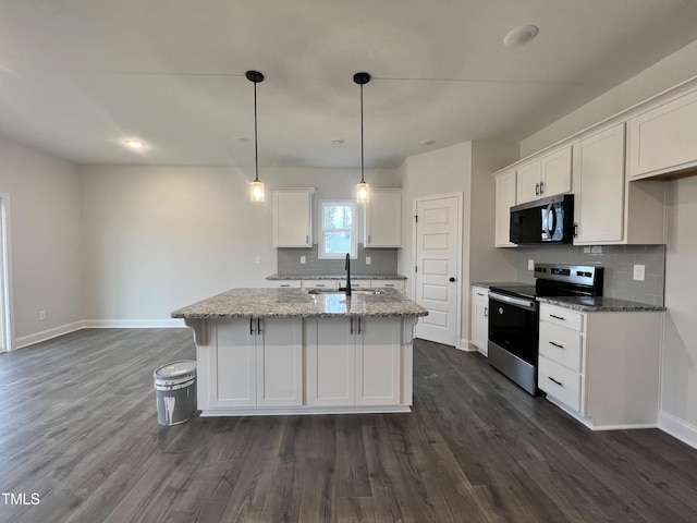 kitchen featuring white cabinetry, an island with sink, and electric range