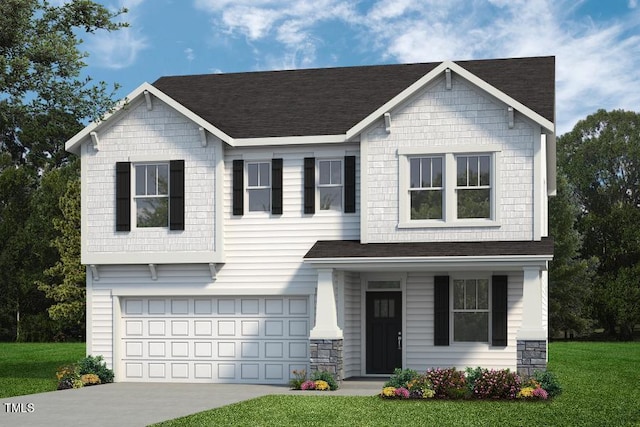 view of front of home featuring a front yard and a garage