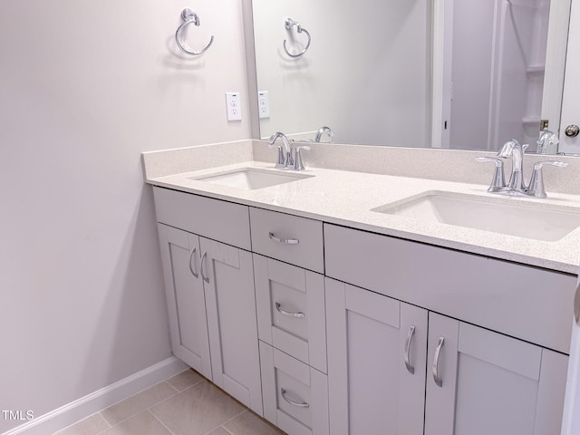 bathroom with vanity and tile patterned floors