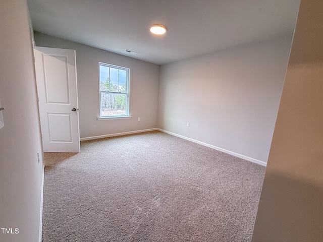 spare room with carpet floors