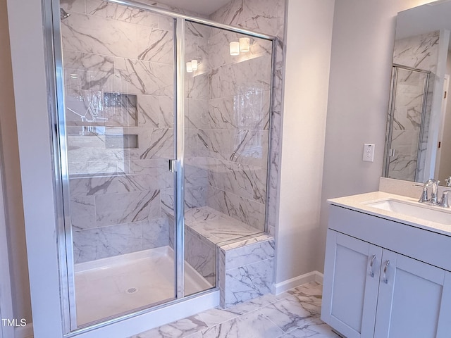 bathroom with vanity and a shower with shower door