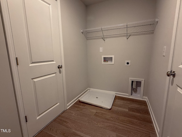 laundry room featuring electric dryer hookup, hookup for a washing machine, and dark hardwood / wood-style floors