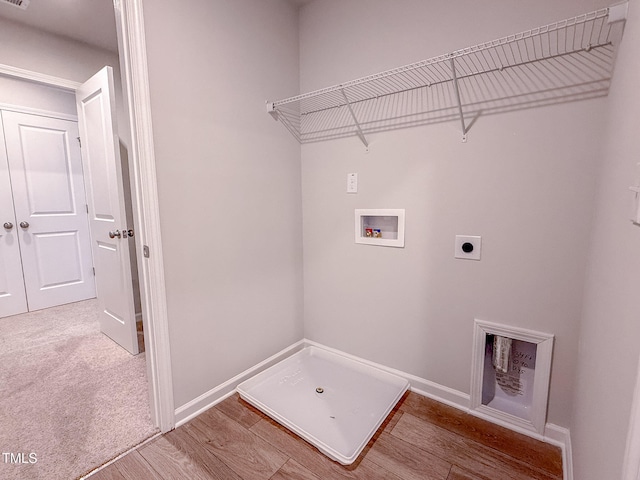 laundry area featuring hardwood / wood-style flooring, hookup for an electric dryer, and hookup for a washing machine