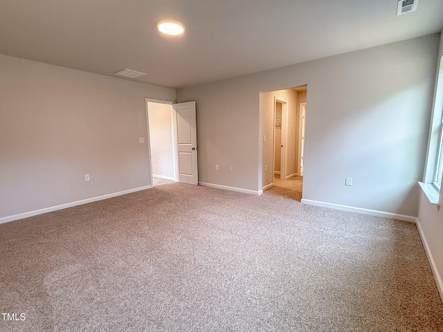 unfurnished bedroom with light carpet