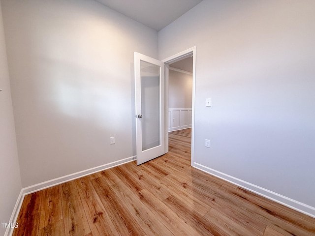 spare room with light hardwood / wood-style flooring