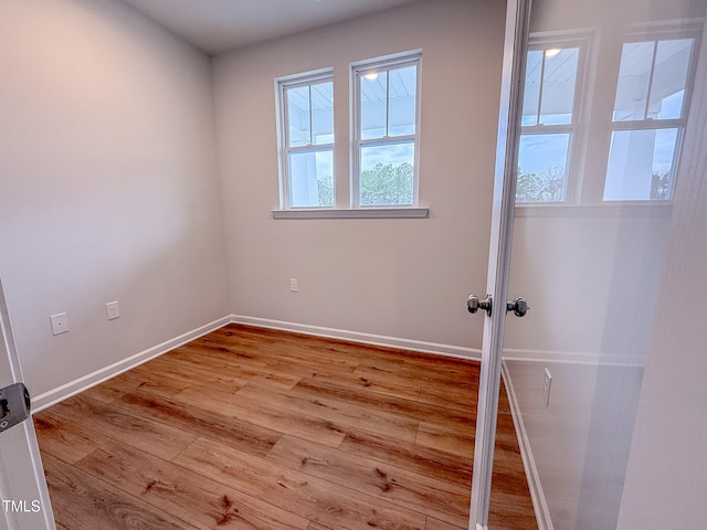 spare room featuring light wood-type flooring