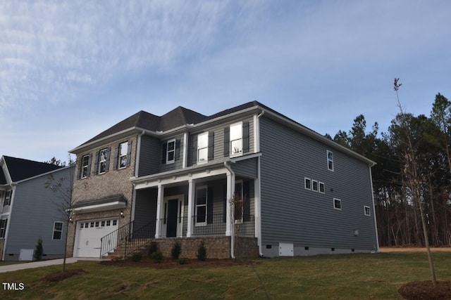 view of front facade with a porch, a garage, and a front lawn