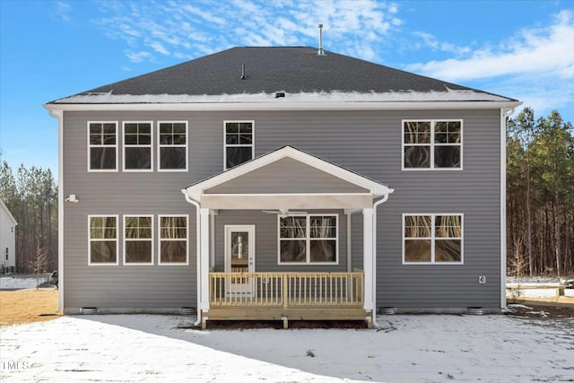 snow covered property featuring covered porch