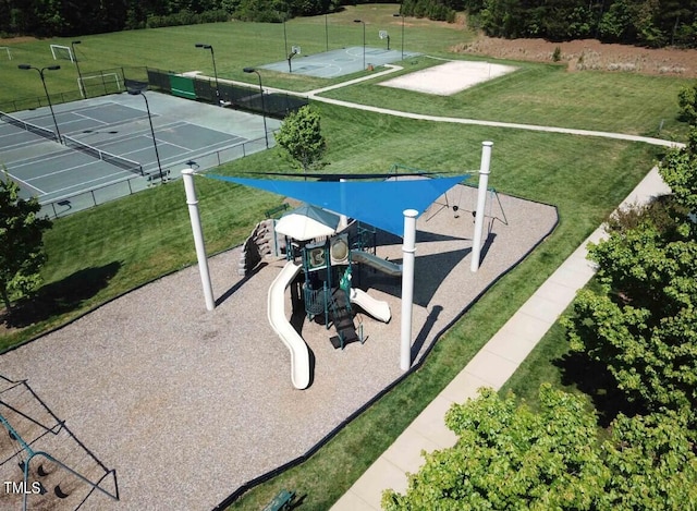 view of home's community with tennis court and a playground