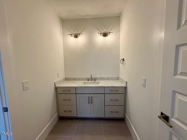 bathroom with tile patterned floors and vanity