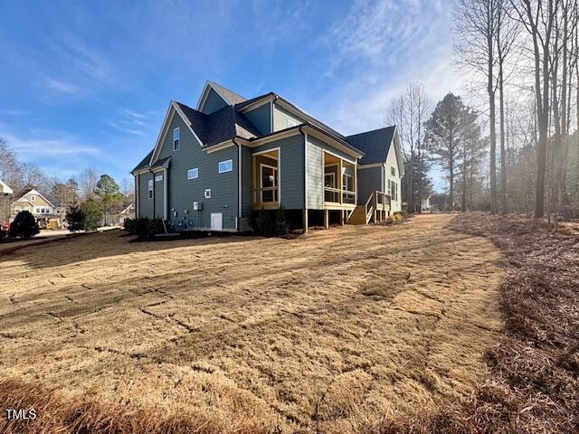 view of property exterior with a lawn