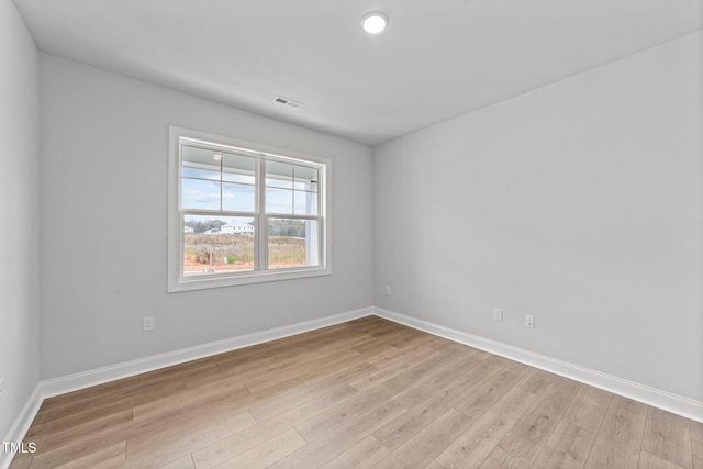 unfurnished room featuring light wood-type flooring