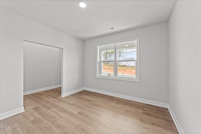 unfurnished room featuring light hardwood / wood-style flooring