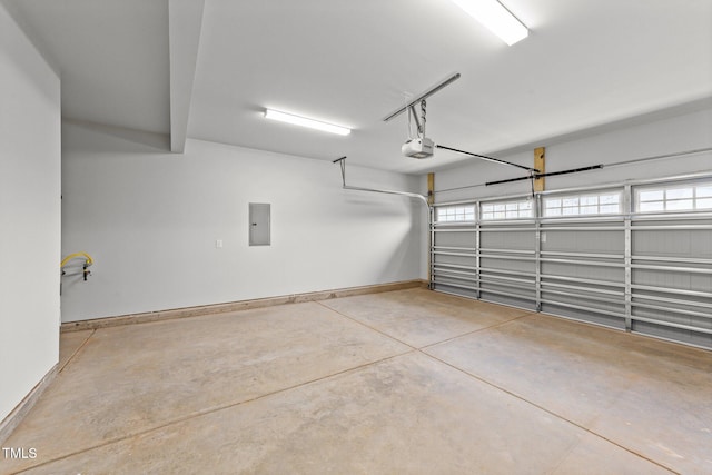 garage featuring a garage door opener and electric panel