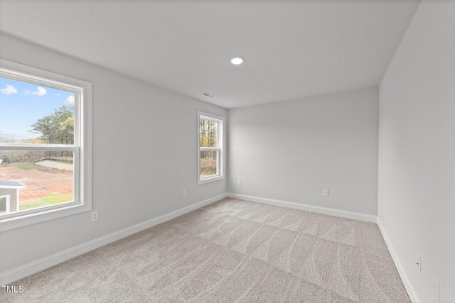 110 Merrifield Ln, Garner, NC 27529 - empty room with baseboards, light carpet, and recessed lighting