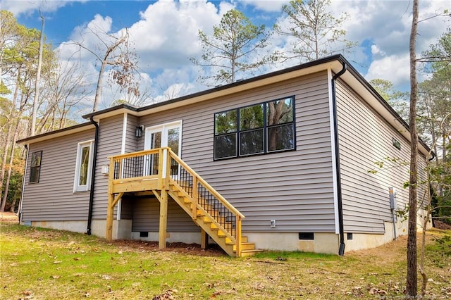 back of house featuring a yard