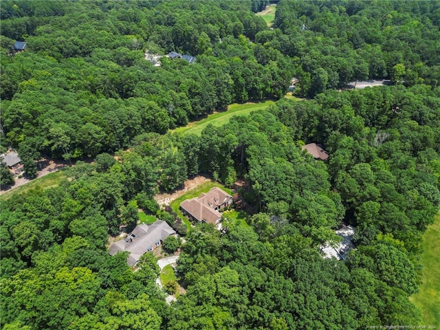 birds eye view of property with a forest view