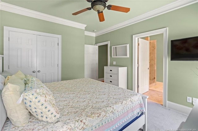 bedroom featuring a ceiling fan, baseboards, a closet, crown molding, and light colored carpet