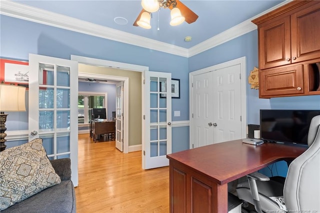 office area with light wood-style flooring, ornamental molding, french doors, and ceiling fan
