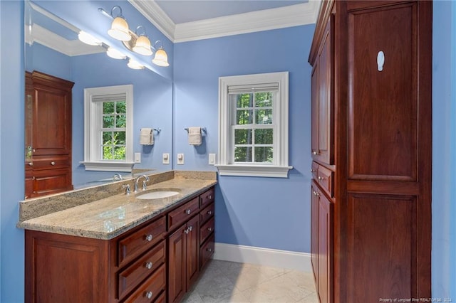 bathroom featuring vanity, baseboards, tile patterned flooring, and ornamental molding