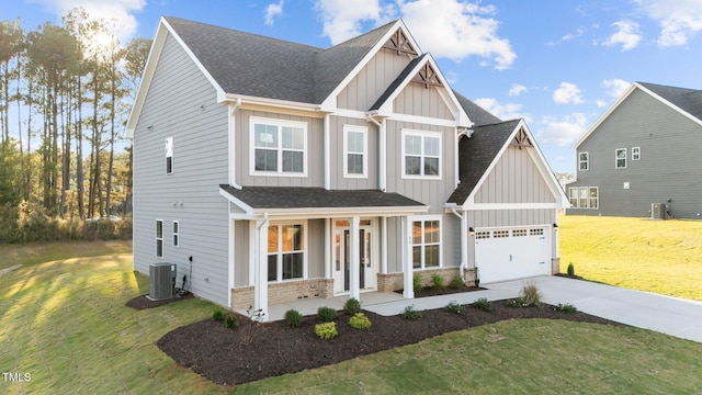 craftsman inspired home featuring a front yard, central AC, and a garage