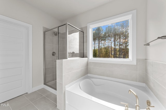 bathroom featuring tile patterned floors and plus walk in shower