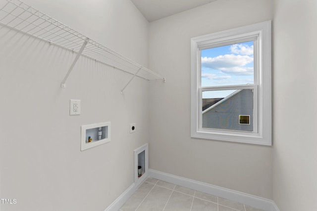 laundry room featuring washer hookup, light tile patterned floors, and electric dryer hookup