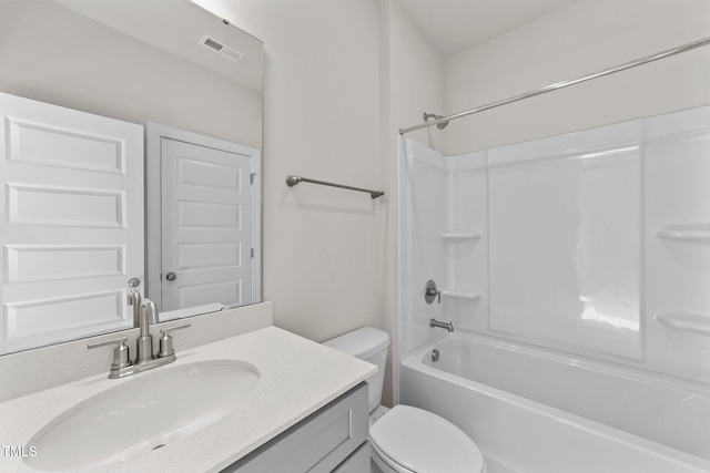 full bathroom featuring toilet, vanity, and shower / washtub combination