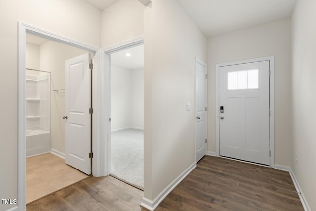 entryway with hardwood / wood-style floors