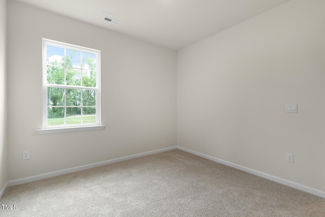 empty room featuring carpet flooring