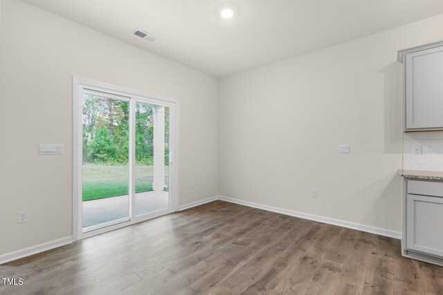 unfurnished room with light hardwood / wood-style floors