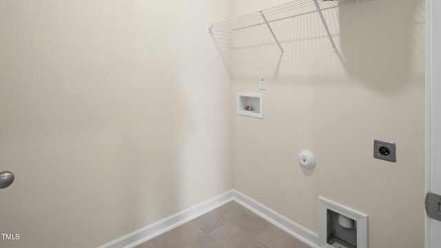 clothes washing area with hookup for a washing machine and electric dryer hookup