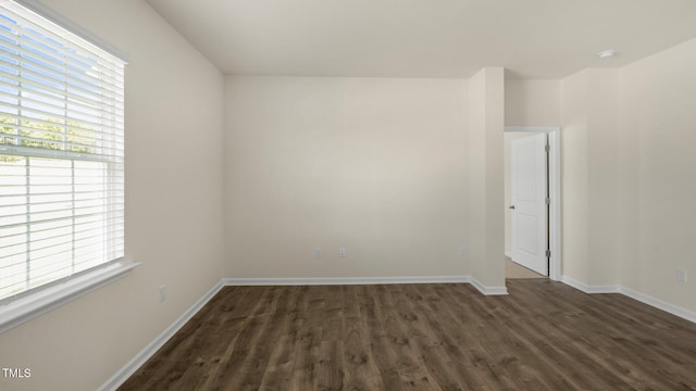 empty room featuring dark hardwood / wood-style floors