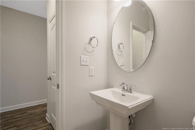 bathroom with wood-type flooring and sink