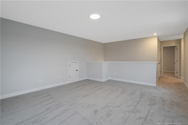 empty room with light colored carpet